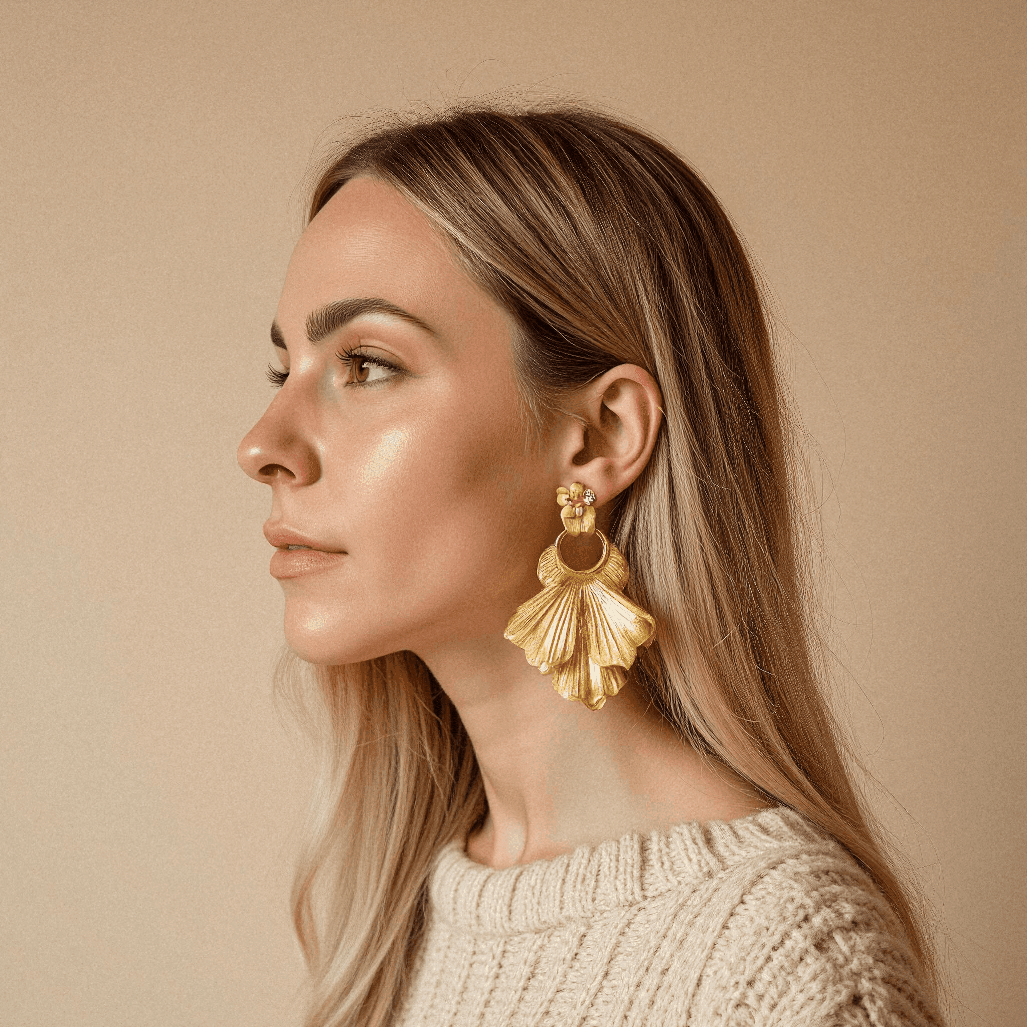 Woman in Beige with Gold Petal Earrings