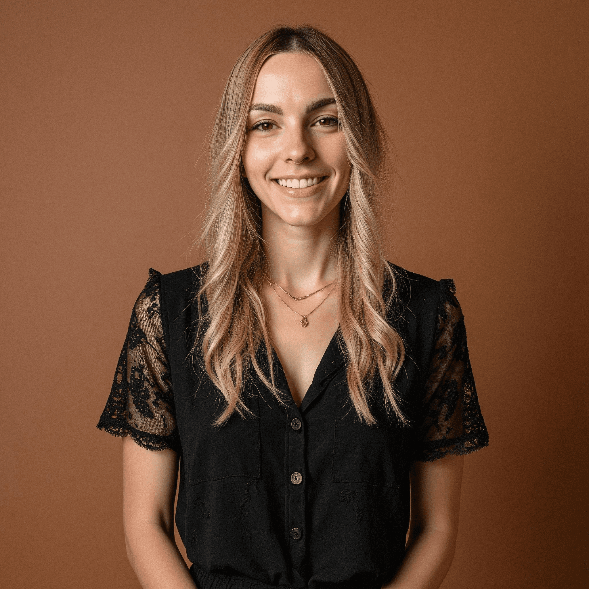Relaxed woman in black lace blouse