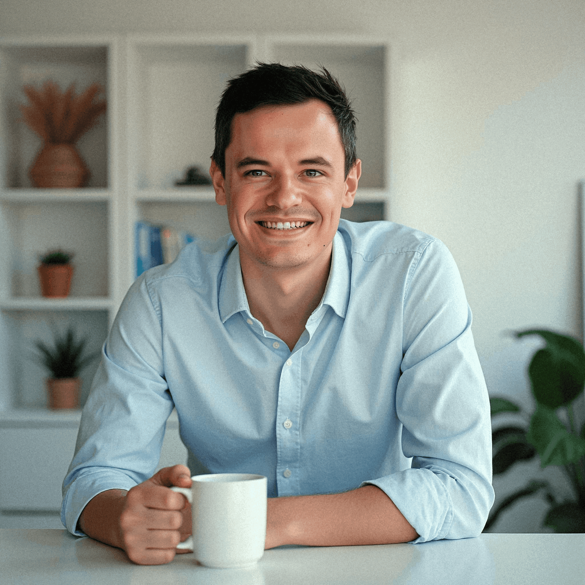 Smiling man in casual office setup