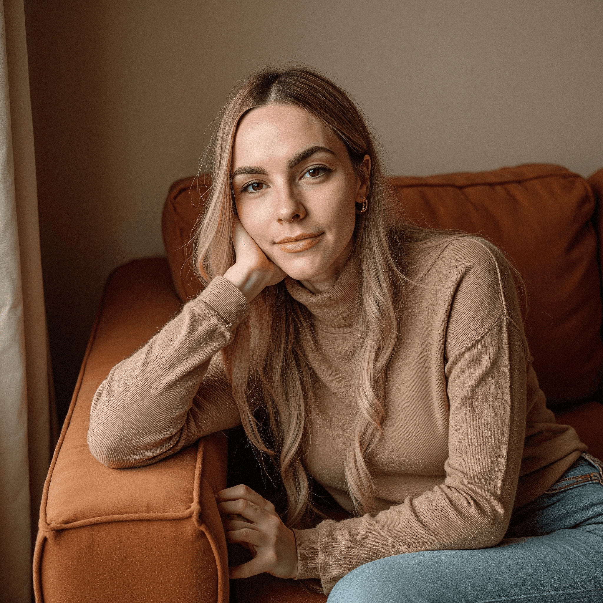 Woman relaxing on corduroy sofa