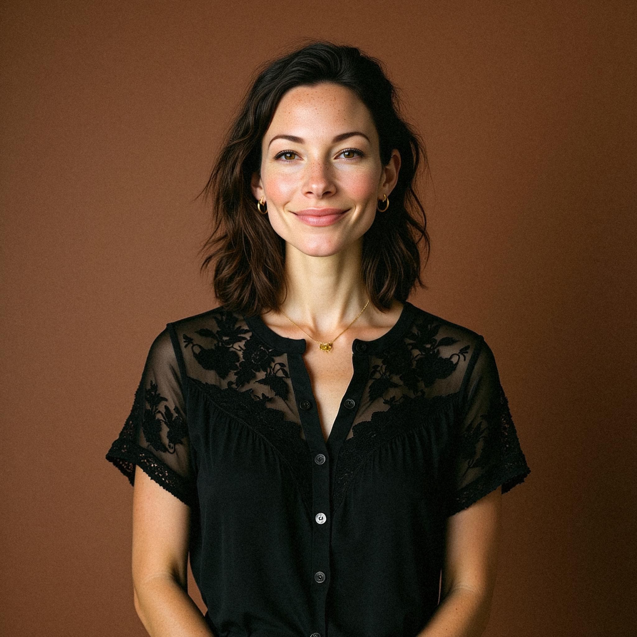 AI-generated professional headshot of Anya, made from their selfies